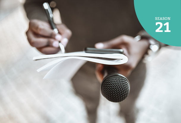 photo: reporter with notebook, pen, and microphone
