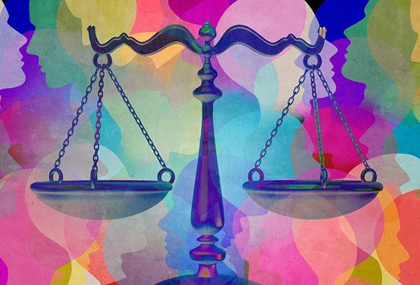 image: scales of justice with bright coloured portraits behind (iStockphoto)