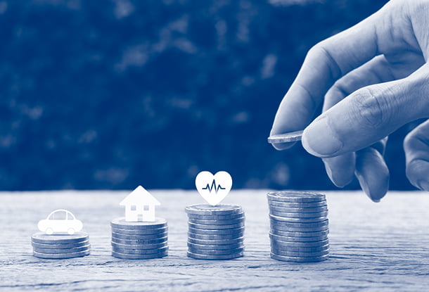 photo: hand stacking coins with icons (iStockphoto)