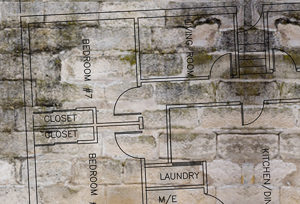 photo illustration: floor plans superimposed on grey bricks