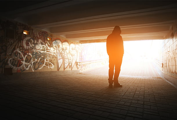 photo: shadowy figure in tunnel (iStockphoto)