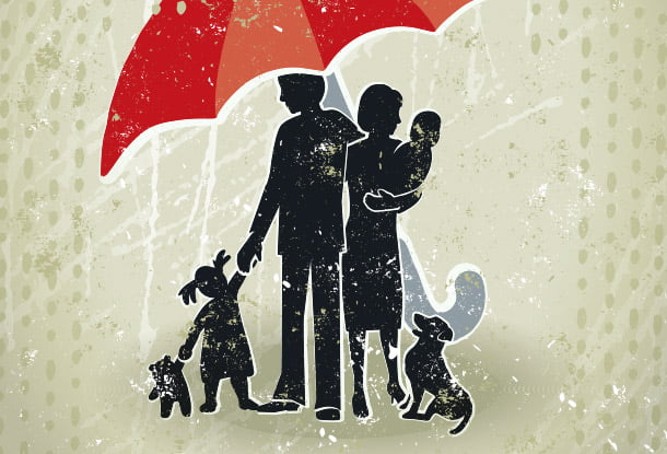 Family under one umbrella (iStockphoto)