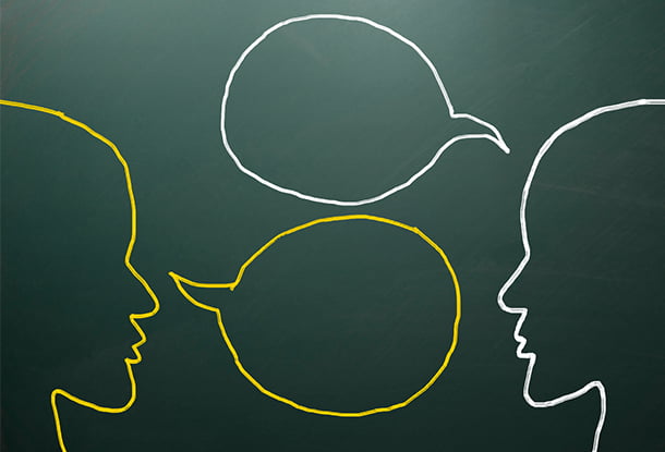 Chalkboard heads with speech bubbles (iStockphoto)