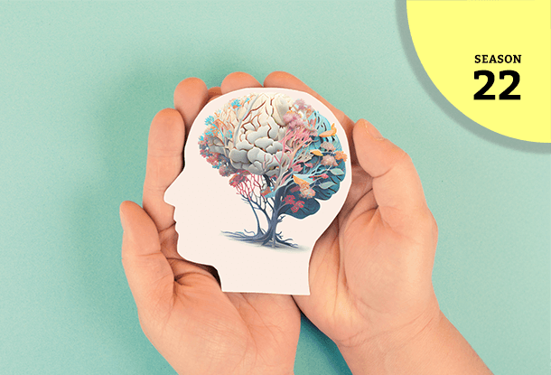 image: hands holding paper head profile with image of a tree/brain (iStockphoto)