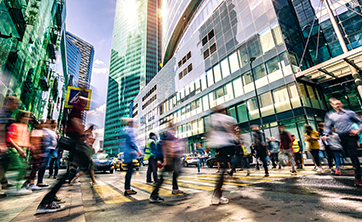 photo: crowd of people in front of tall buildings (iStockphoto)