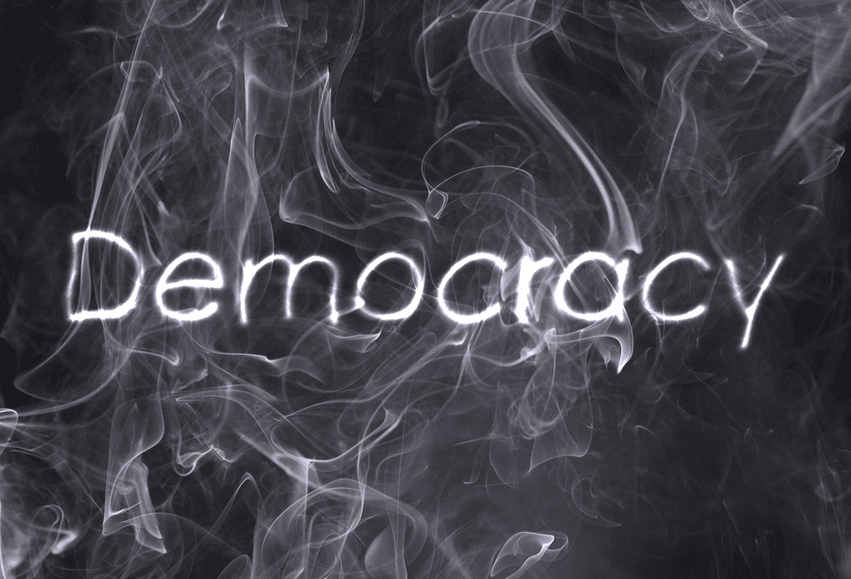 Image: the word "Democracy" make of smoke (cc Maytree)