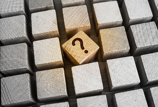 image: ordered blocks with one question mark block askew (iStockphoto)