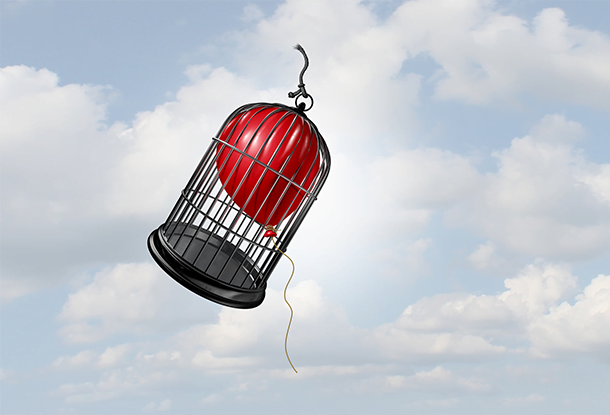 image: balloon floating, despite being trapped in a cage (iStockphoto)