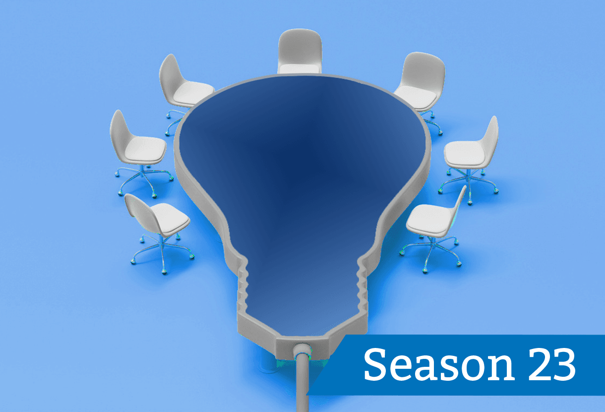 image: empty chairs positioned around a table shaped like a lightbulb (iStockphoto)