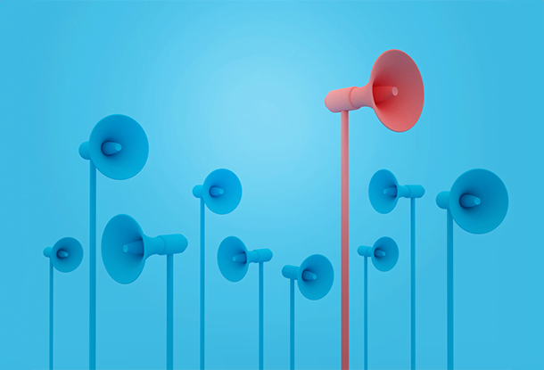 image: blue megaphones and one red one (iStockphoto)